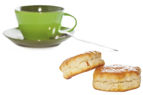 Two buttery scones and tea cup — Stock Photo, Image