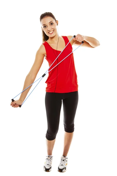Menina se exercitando com faixa de fitness elástica — Fotografia de Stock