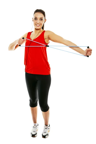 Flicka tränar med elastisk fitness band — Stockfoto