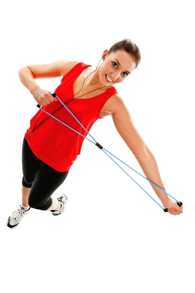 Menina se exercitando com faixa de fitness elástica — Fotografia de Stock
