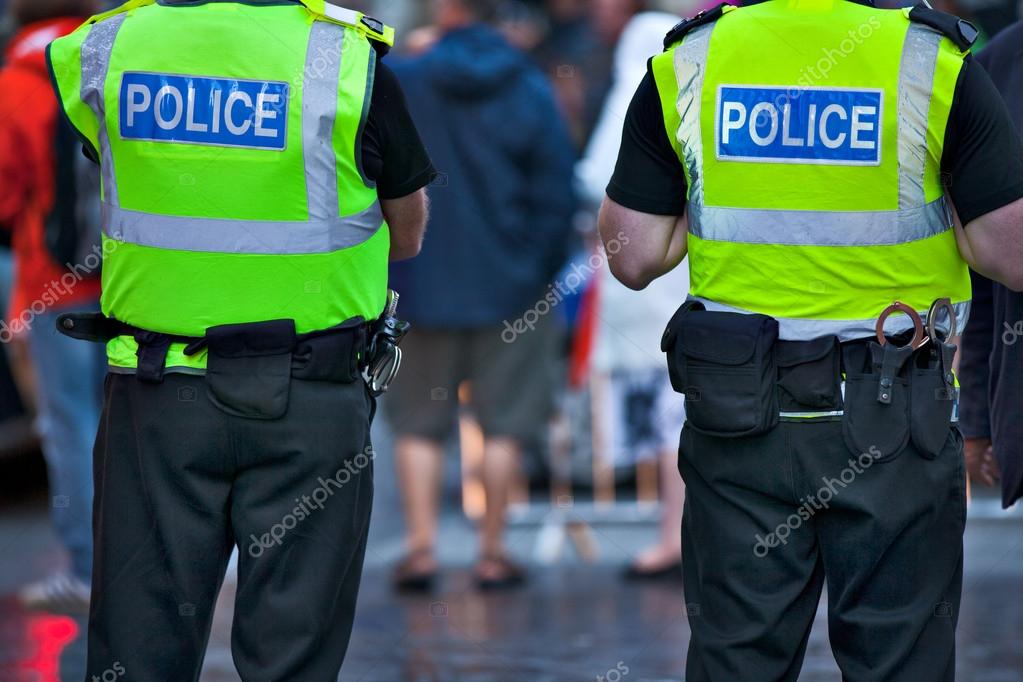 Police officers on duty — Stock Photo © SergeBertasiusPhotography 18612887