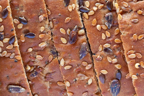 Multiseeded bread's crust sliced — Stock Photo, Image