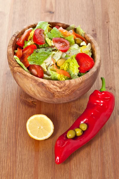 Wooden bowl with salad — Stock Photo, Image