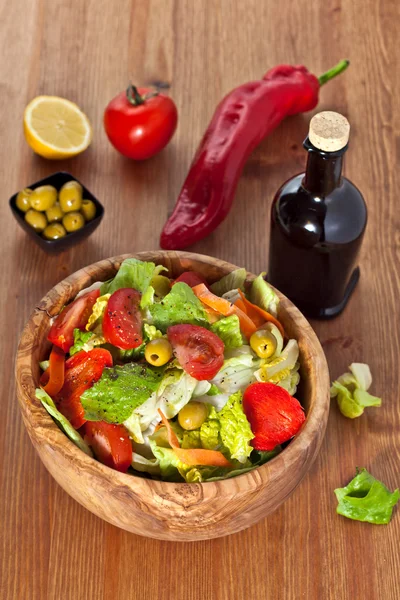 Wooden bowl with salad — Stock Photo, Image