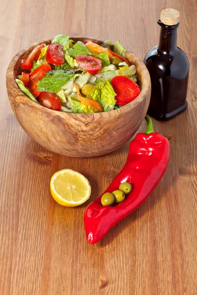 Wooden bowl with salad — Stock Photo, Image