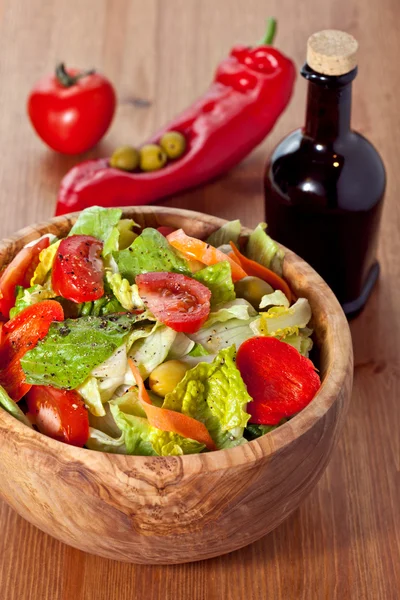 Wooden bowl with salad — Stock Photo, Image