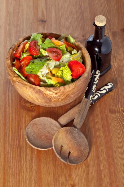 Wooden bowl with salad — Stock Photo, Image