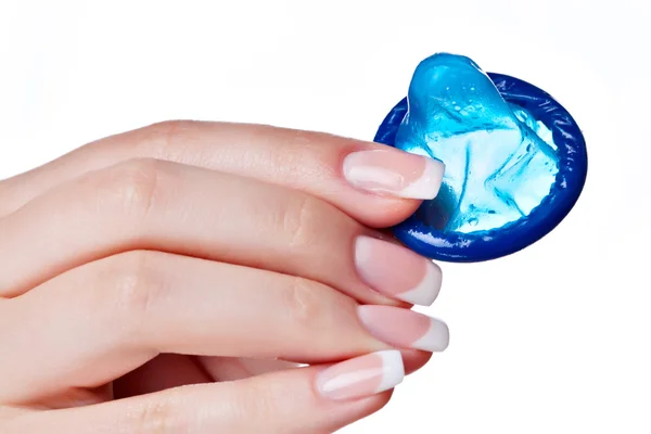 Hand holding a condom — Stock Photo, Image