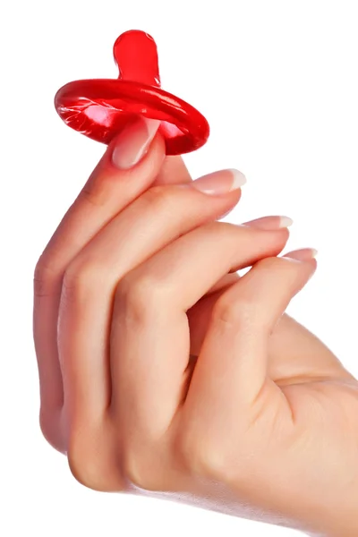 Hand holding a condom — Stock Photo, Image