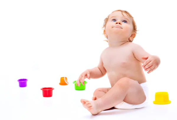 Söt spädbarn pojke med leksaker — Stockfoto