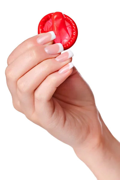 Hand holding a condom — Stock Photo, Image