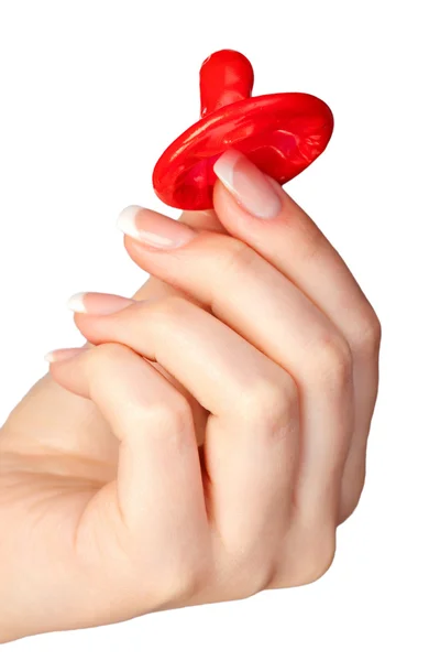 Hand holding a condom — Stock Photo, Image