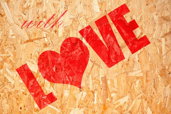 Панель прессованной пилы с надписью LOVE — стоковое фото