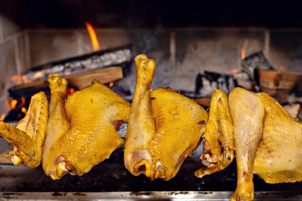 Chicken roasting on skewer — Stock Photo, Image