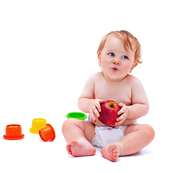 Ładny chłopak niemowląt z jabłkiem — Zdjęcie stockowe
