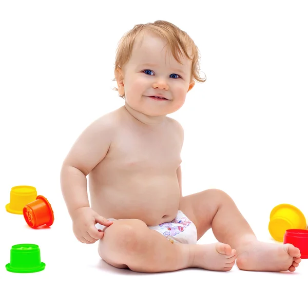 Cute infant boy with toys Royalty Free Stock Photos