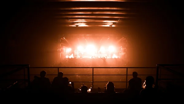 Silhouettes of , watching a bang on stage — Stock Photo, Image