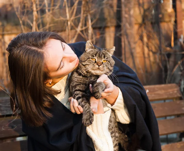 Young woman with a cat — Stock Photo, Image