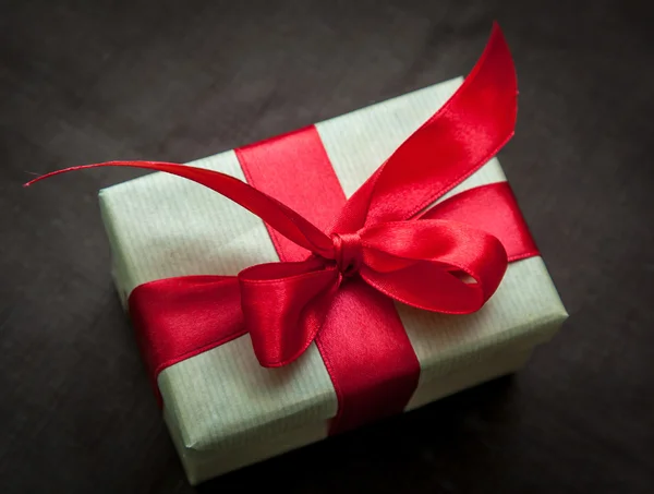 Gift box with red ribbon — Stock Photo, Image