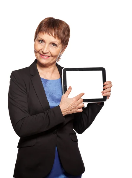 Attractive woman 50 years old with a tablet in hands — Stock Photo, Image