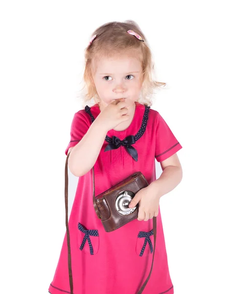 Curly-haired little girl with vintage camera isolated — Stock Photo, Image