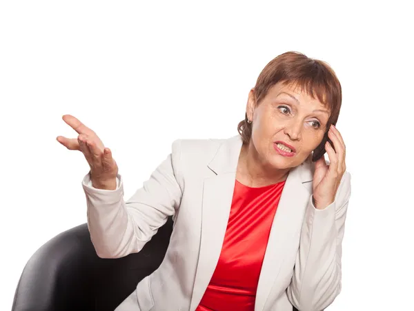 Attraktiv kvinna 50 år gammal med en mobiltelefon — Stockfoto