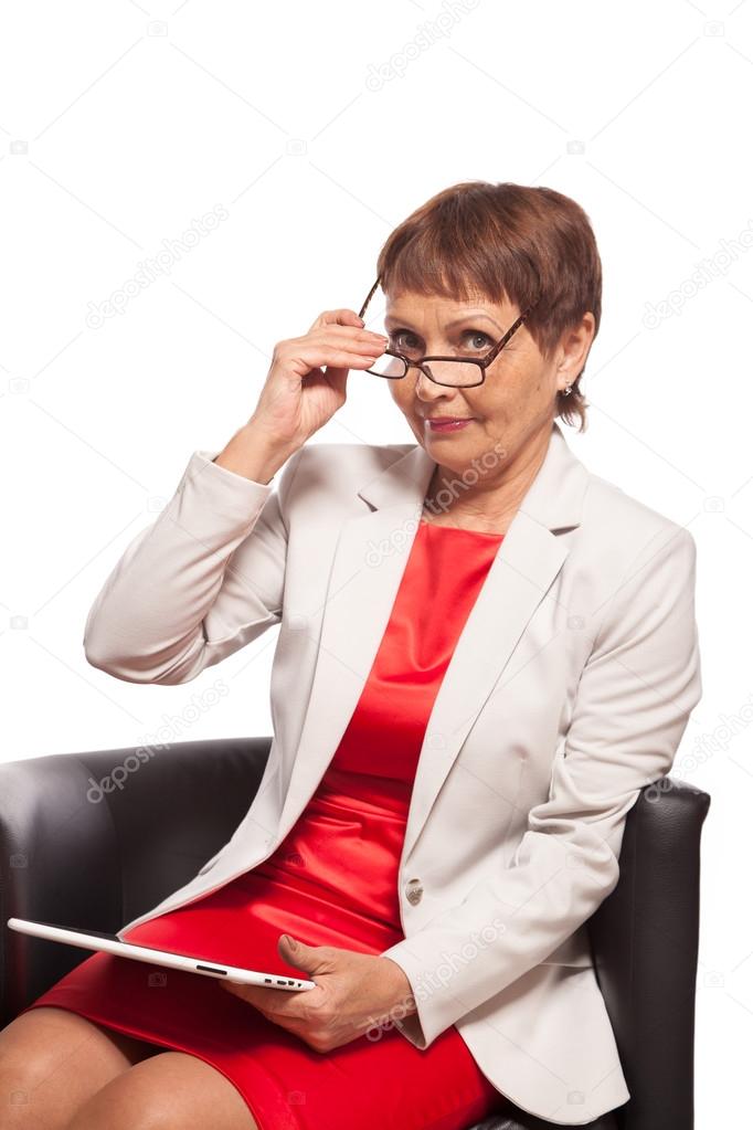 attractive woman 50 years old with a tablet computer