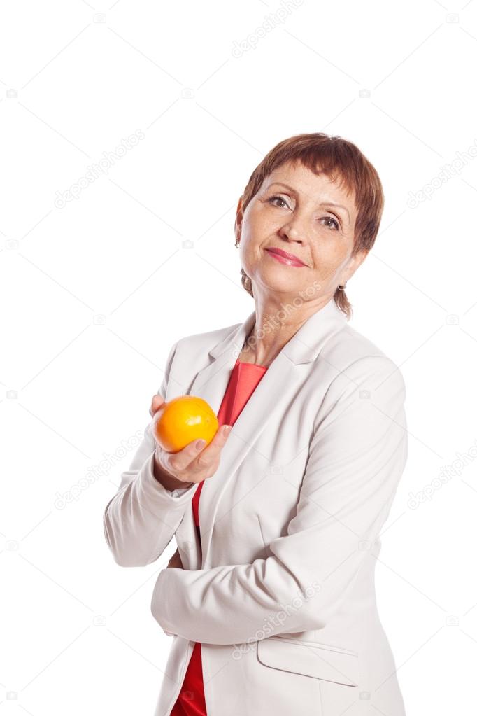 attractive woman 50 with orange in hand