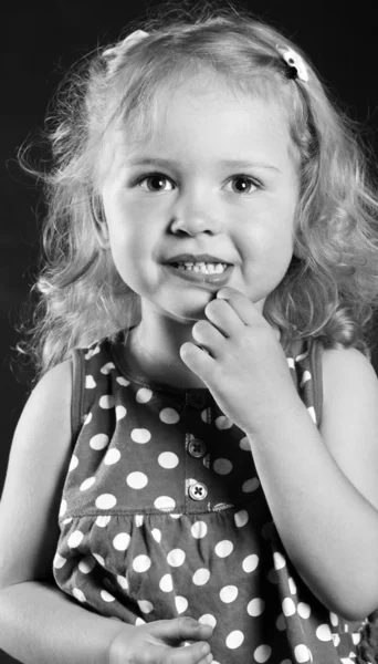 Cute little girl 3 years old thought looking at the camera — Stock Photo, Image