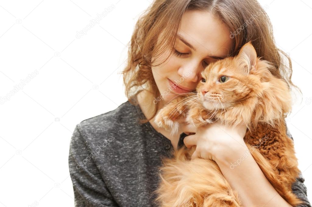 beautiful young woman 20 years with a fluffy red cat isolated