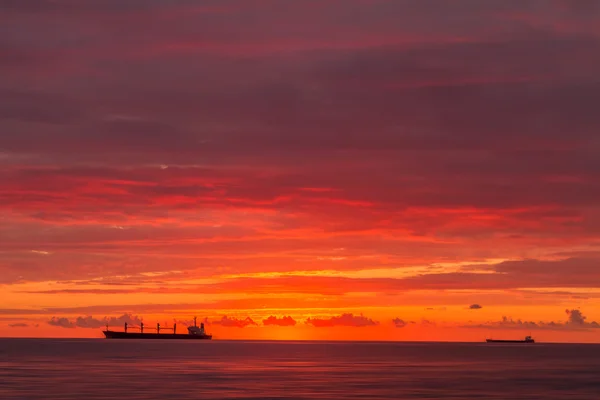 Ships at sunset, the defocused image — Stock Photo, Image