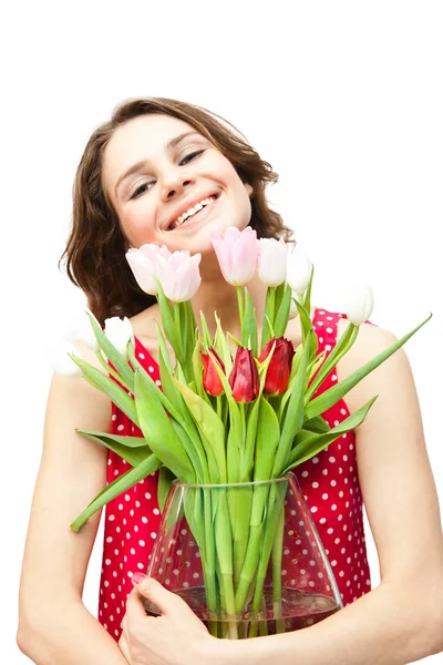 Young beautiful woman with a vase of flowers, isolated on white — Stock Photo, Image