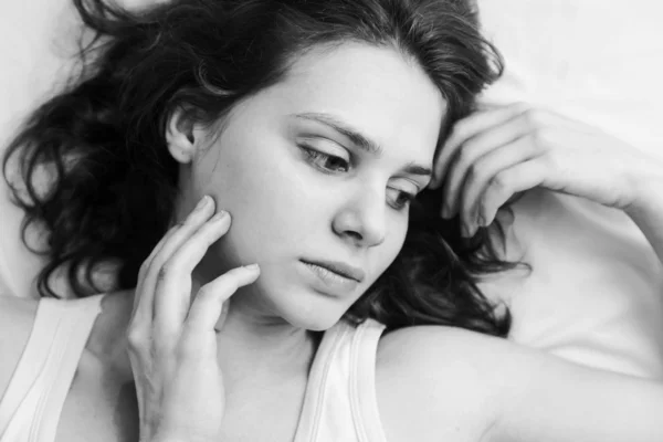 Portrait of a beautiful young woman with curly hair, black and w — Stock Photo, Image