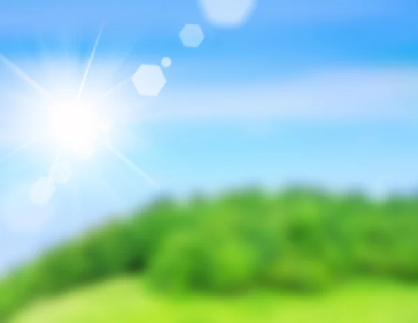 Yeşil alan ve mavi gökyüzü, yaz arka plan bulanık resim — Stok fotoğraf