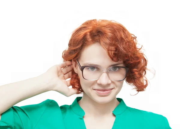 Red-haired girl in glasses thinking isolated on white — Stock Photo, Image