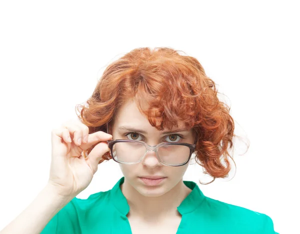 Red-haired girl in glasses thinking isolated on white — Stock Photo, Image