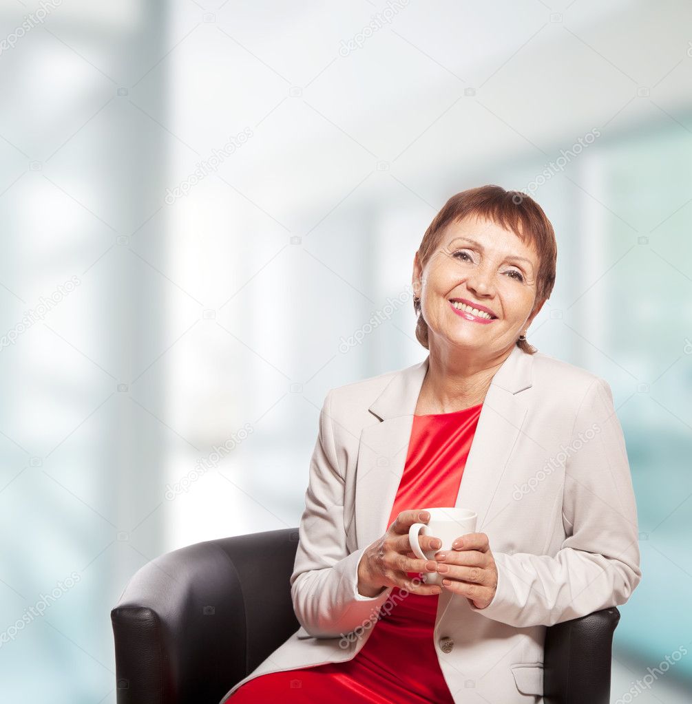 attractive woman 50 years old with cup of  coffee