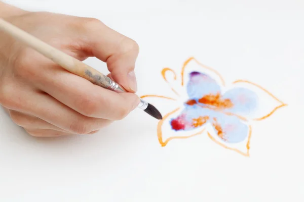 Brush in the hands of the artist — Stock Photo, Image