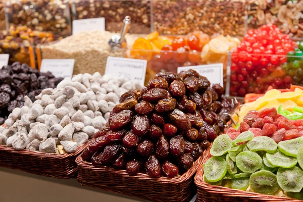 Counter with a variety of nuts and dried fruit — Stock Photo, Image