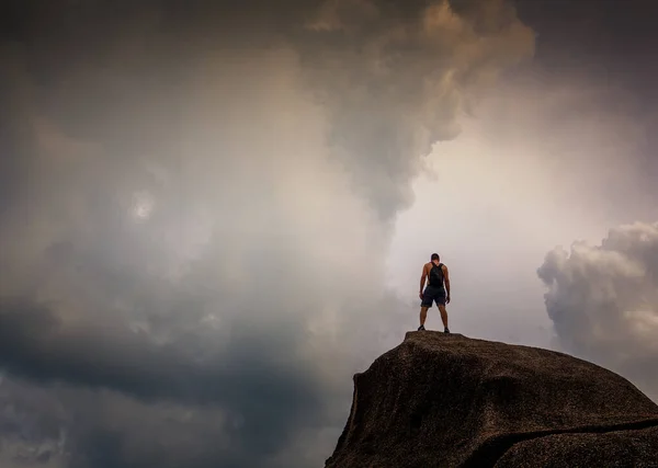 Young Man Standing Stone Overlooking Dramatic Cloudy Sky Travel Adventure — 图库照片