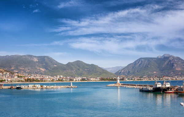 Lighthouse in the port of Alanya, Turkey. Beautiful seascape, summer travel to Turkey