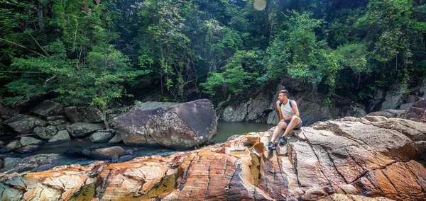 Young Male Traveler Backpack Sitting Stones River Jungle Enjoying Nature — 图库照片