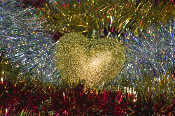 Heart of gold and tinsel Stock Image