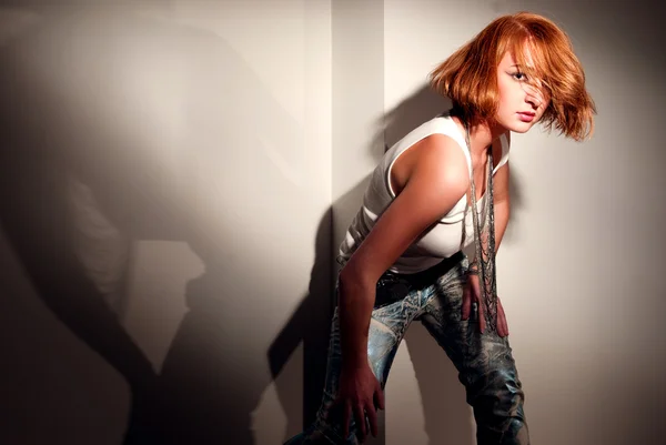 Portrait of a beautiful girl in the style of punk with dramatic lighting — Stock Photo, Image