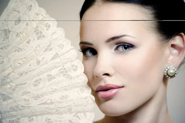 Portrait of a girl with a fan — Stock Photo, Image