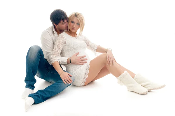 Pregnant woman with her husband on white — Stock Photo, Image