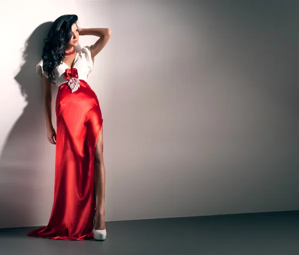 Beautiful girl in a red dress — Stock Photo, Image