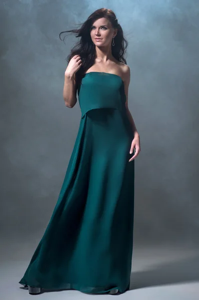 Woman in green evening dress — Stock Photo, Image