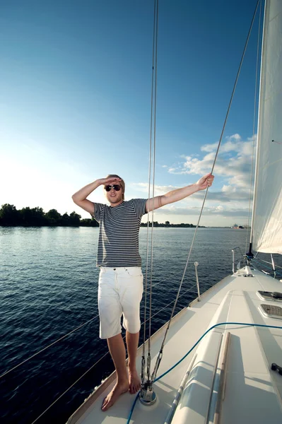 Happy young man on a yacht — Stock Photo, Image