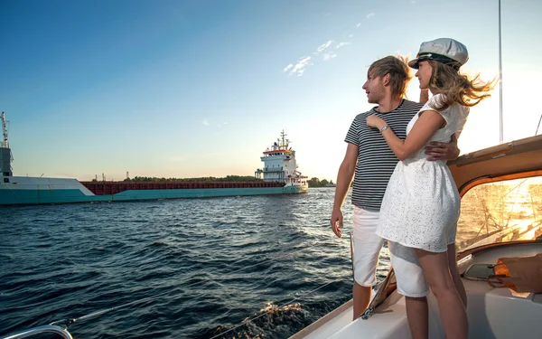 Happy young couple relaxing on a yacht — Stock Photo, Image